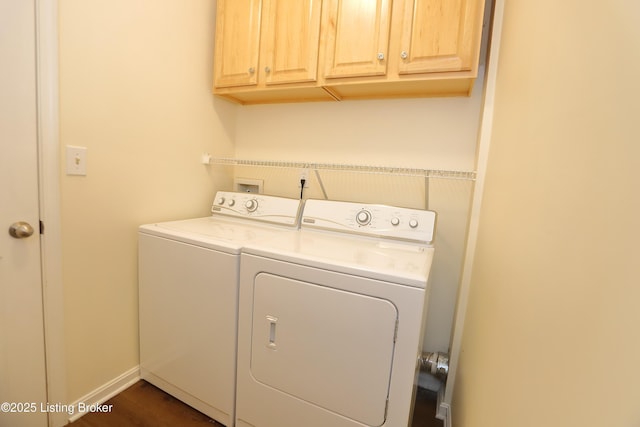 laundry room with washer and dryer, cabinet space, and baseboards