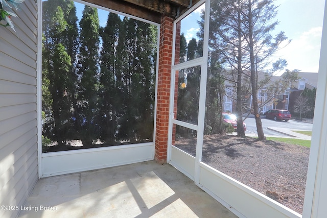 unfurnished sunroom featuring a wealth of natural light