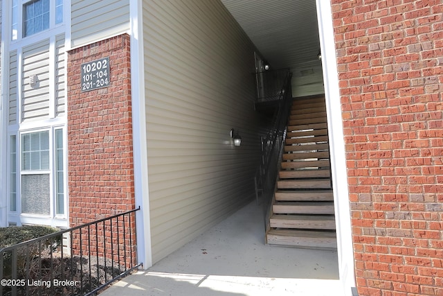 exterior space featuring brick siding