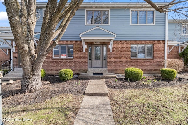 view of front of house featuring brick siding