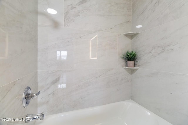 bathroom featuring  shower combination