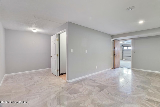 empty room featuring baseboards