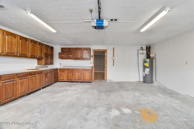 garage with electric water heater and a garage door opener