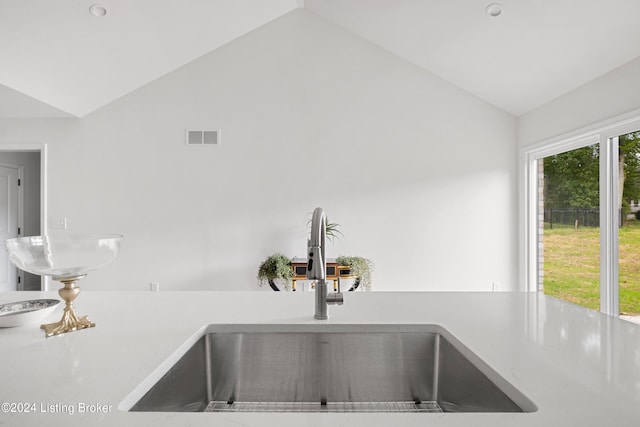 interior details featuring light countertops, visible vents, and a sink