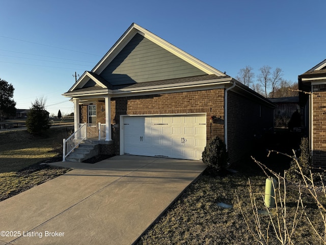 view of front facade with a garage, concrete driveway, and brick siding