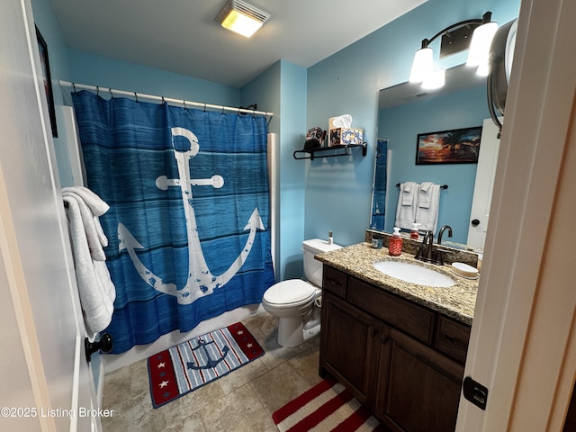 bathroom with curtained shower, vanity, and toilet