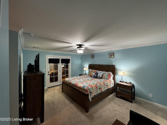 carpeted bedroom featuring baseboards, visible vents, ceiling fan, ornamental molding, and french doors