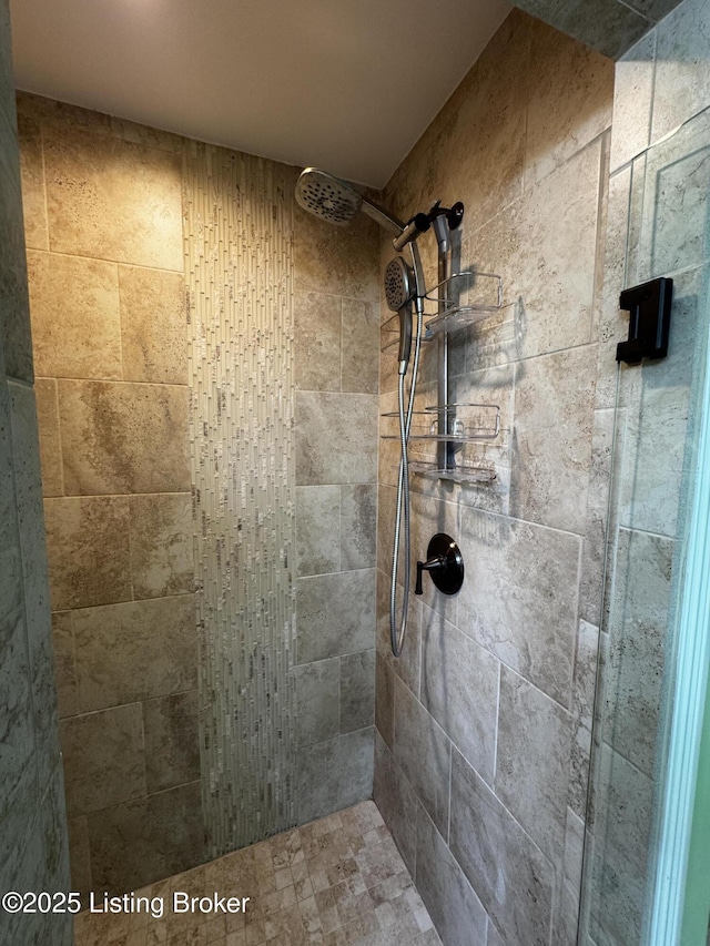 full bath featuring a tile shower