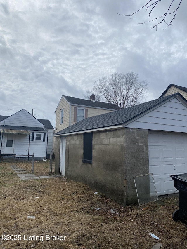 view of home's exterior featuring roof with shingles