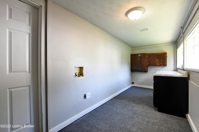 laundry room with hookup for a washing machine, hookup for an electric dryer, visible vents, baseboards, and dark colored carpet