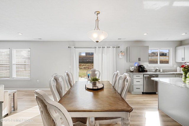 dining space featuring plenty of natural light, light wood-style flooring, and recessed lighting