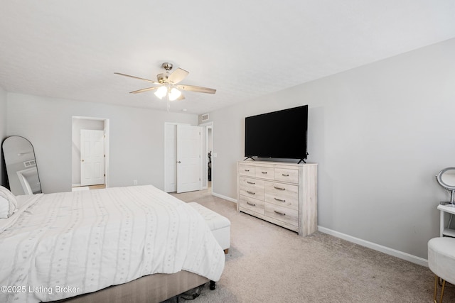 bedroom featuring ceiling fan, baseboards, and light colored carpet