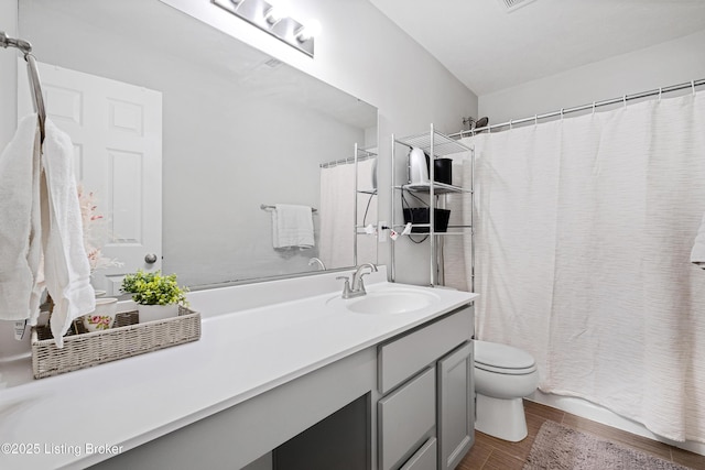 full bathroom featuring toilet, shower / bath combo, wood finished floors, and vanity