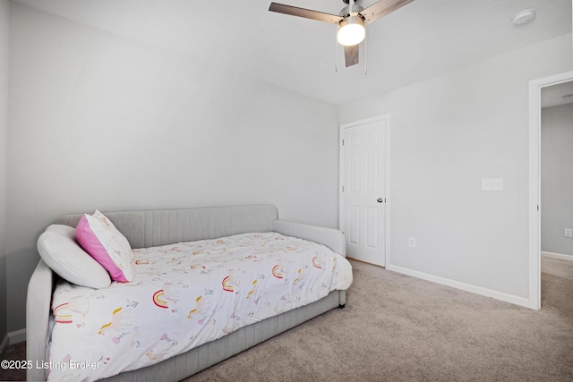 bedroom with carpet floors, baseboards, and a ceiling fan