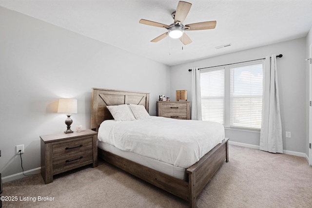 bedroom with visible vents, ceiling fan, light carpet, and baseboards