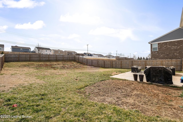 view of yard with a patio and a fenced backyard