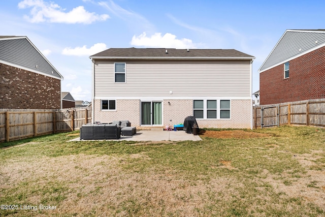 rear view of house featuring a yard, a fenced backyard, an outdoor hangout area, and a patio