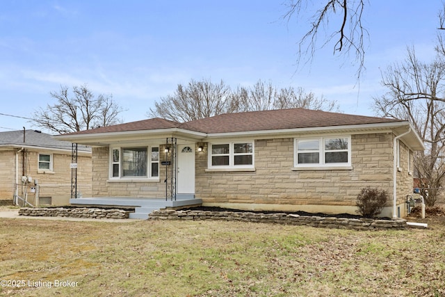 ranch-style house featuring covered porch, stone siding, a shingled roof, and a front lawn