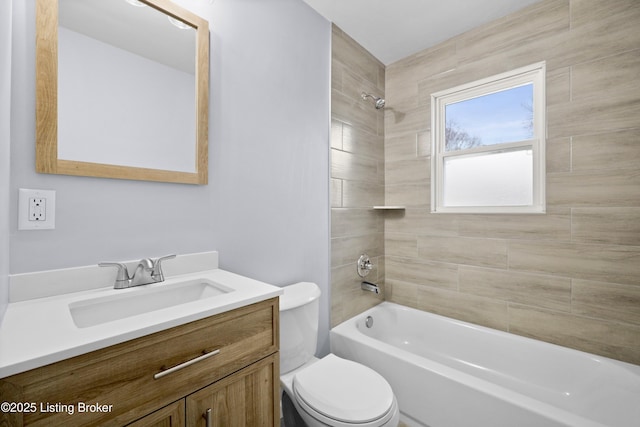 full bath with vanity, shower / tub combination, and toilet