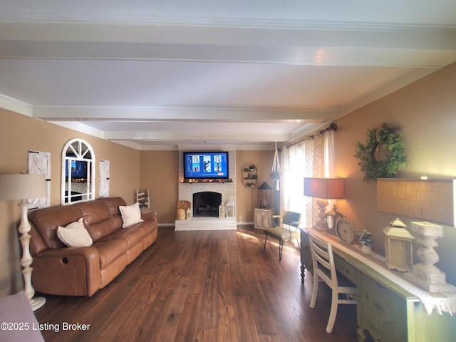 living area featuring a fireplace, baseboards, beam ceiling, and wood finished floors