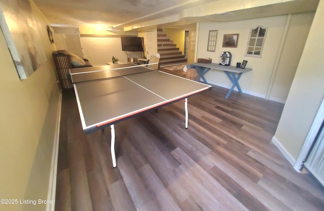 recreation room with wood finished floors and baseboards