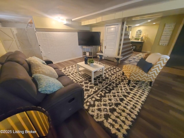 living area featuring stairs and wood finished floors