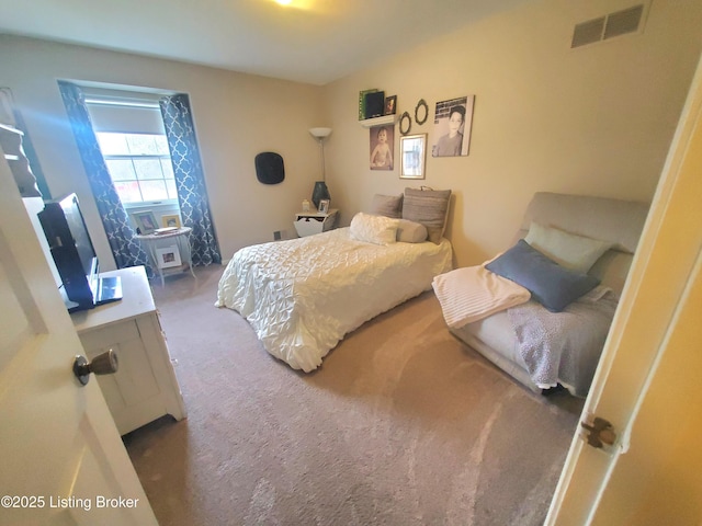 carpeted bedroom with visible vents