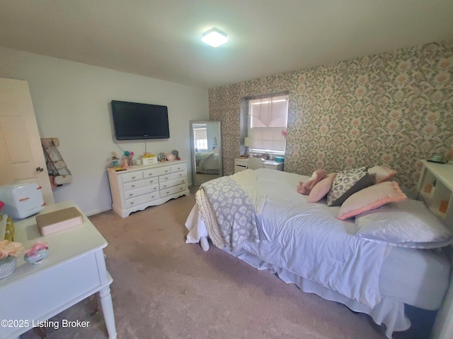 carpeted bedroom with wallpapered walls