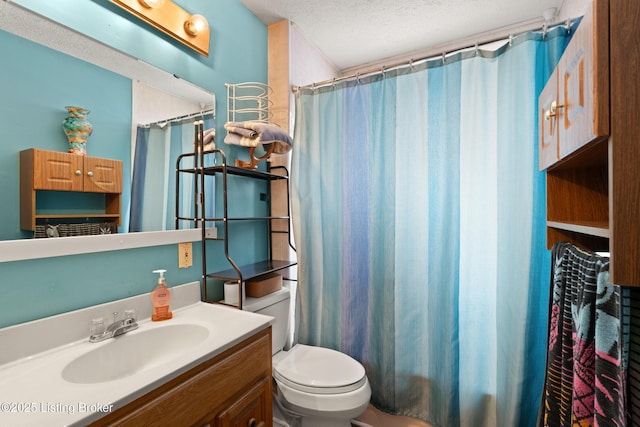 bathroom featuring toilet, a shower with curtain, a textured ceiling, and vanity