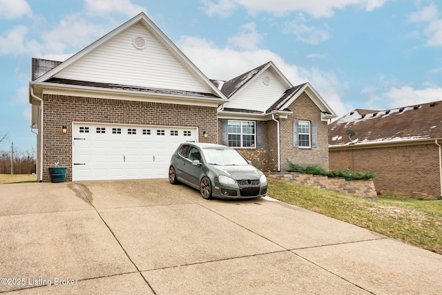 view of front facade featuring concrete driveway, brick siding, and an attached garage