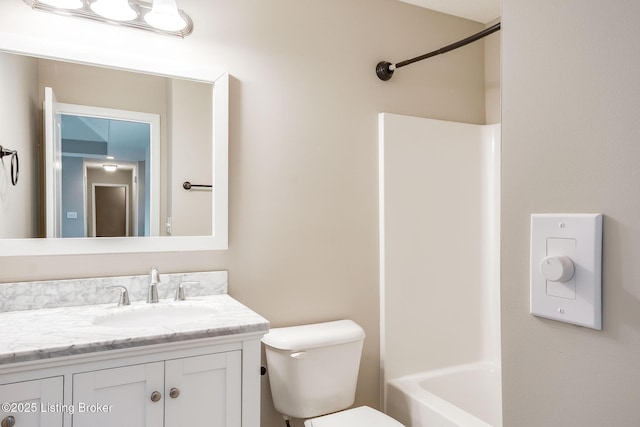 bathroom featuring toilet and vanity