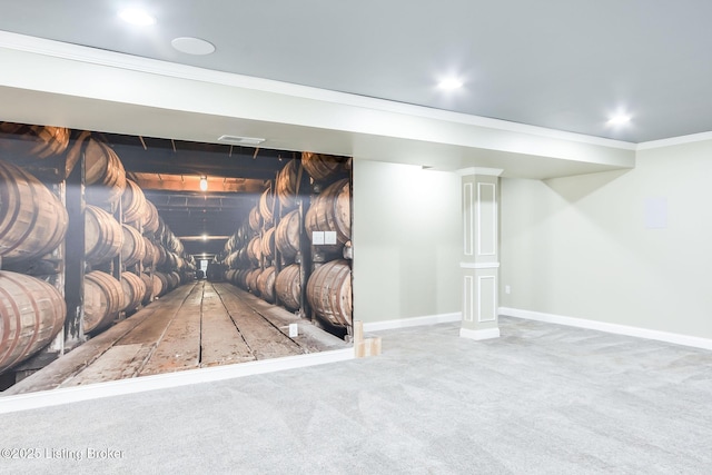 interior space with baseboards, carpet flooring, and crown molding