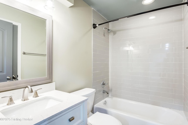 bathroom with  shower combination, vanity, toilet, and recessed lighting