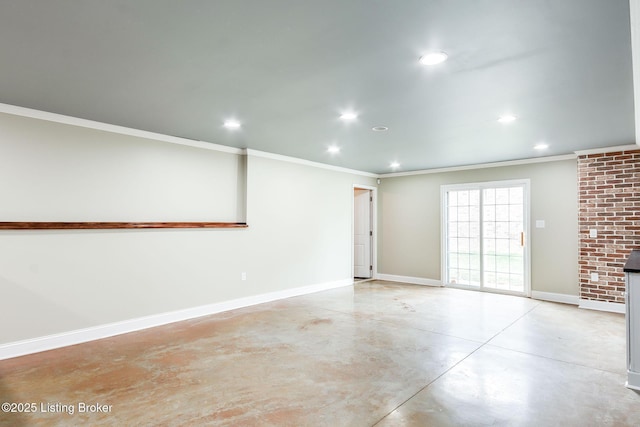 spare room featuring finished concrete floors, recessed lighting, ornamental molding, and baseboards