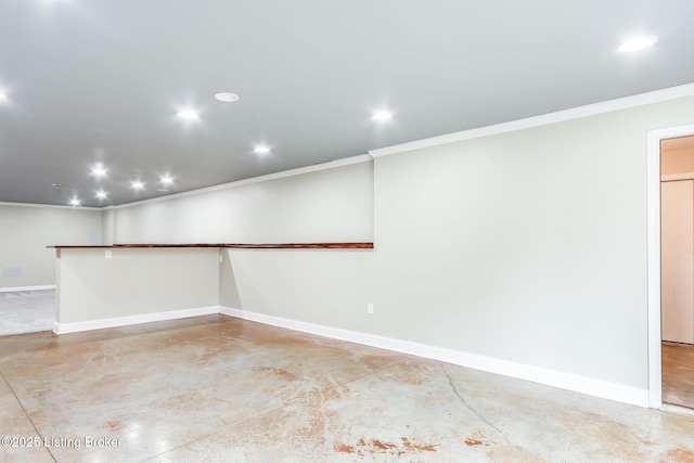 below grade area with recessed lighting, crown molding, and baseboards