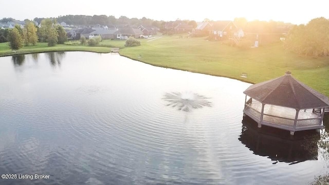 birds eye view of property with a water view and a residential view