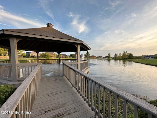 dock area with a water view and a gazebo