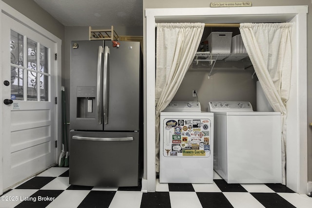 clothes washing area with laundry area, independent washer and dryer, and tile patterned floors