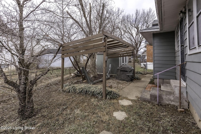 view of yard with fence and a detached carport