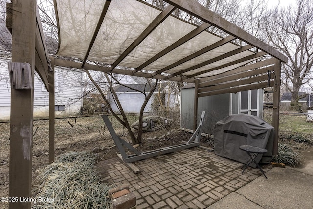 view of patio / terrace featuring area for grilling, fence, and a pergola