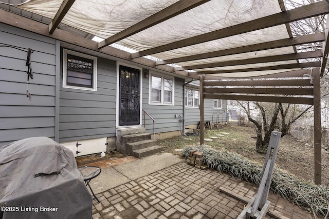 view of patio with entry steps and a pergola