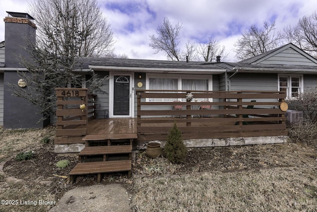 view of front of home featuring cooling unit and a deck