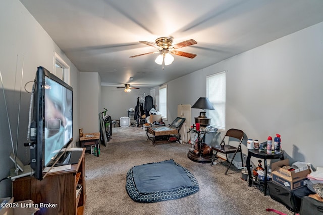 interior space featuring carpet flooring and a ceiling fan