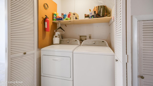 laundry area featuring washer and clothes dryer and laundry area