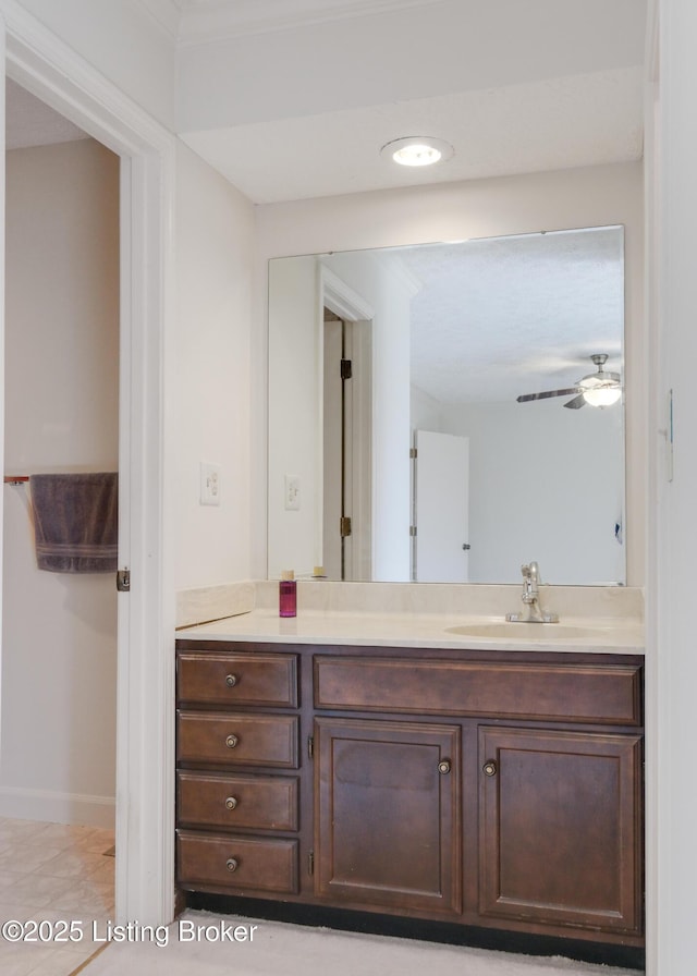 bathroom featuring ceiling fan and vanity