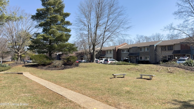 view of home's community featuring a yard