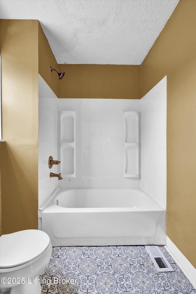 full bath featuring  shower combination, visible vents, toilet, and tile patterned floors