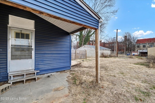 view of yard featuring fence and a patio