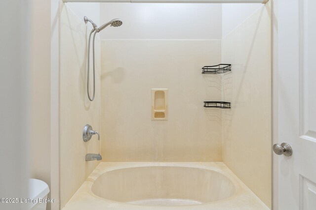 full bath featuring washtub / shower combination and toilet