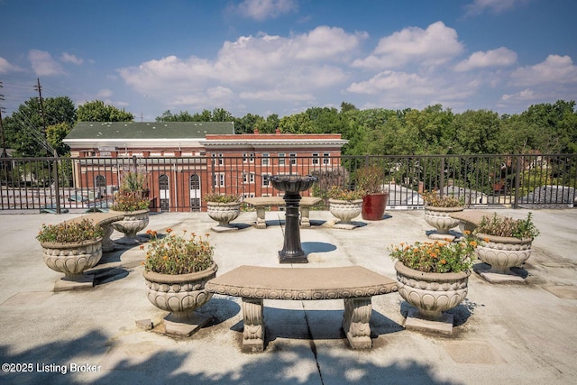 view of patio featuring fence